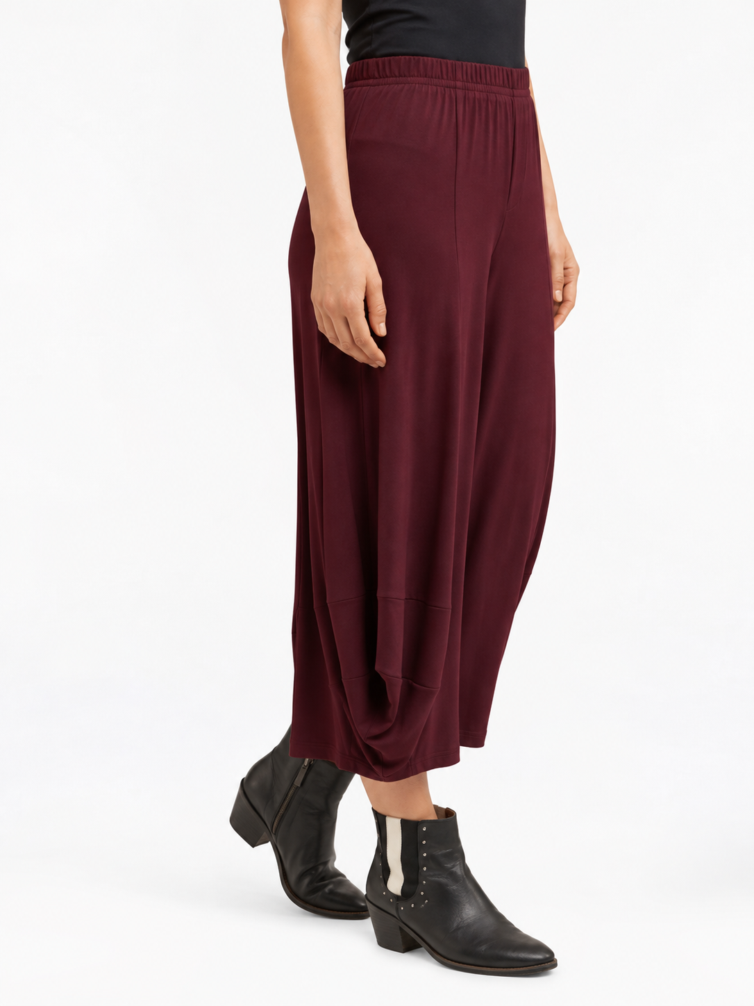 angled side view of the Shiraz Red Marlee Wide Leg Pants, showing the side drape and leg shape