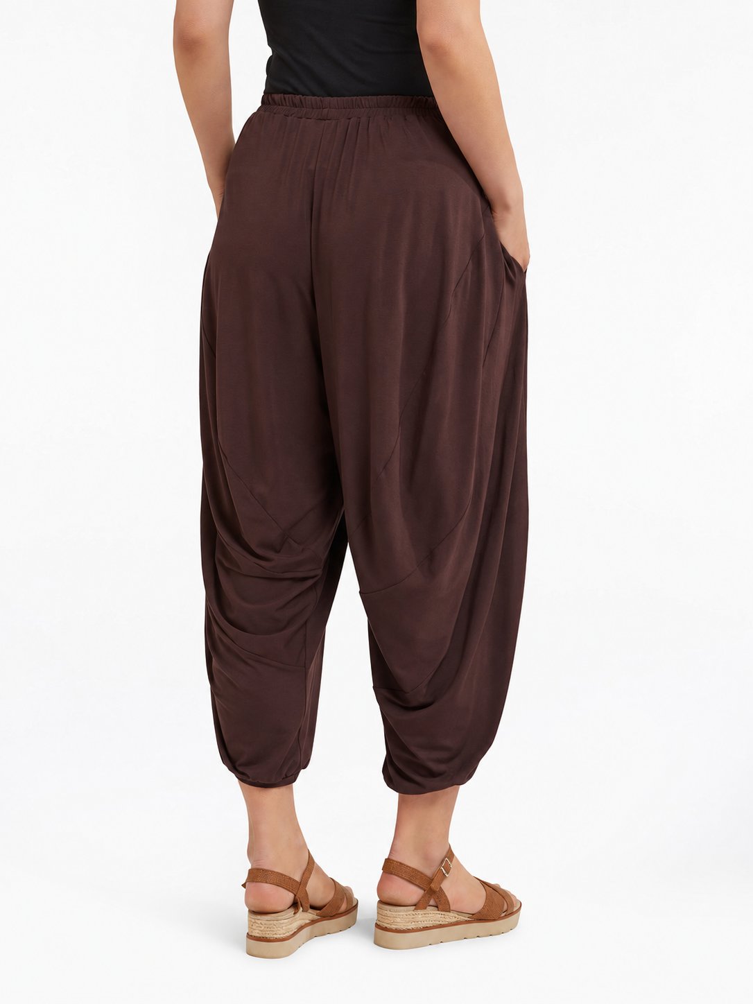 Back view of Cocoa Brown Akira Barrel Pants, showing the draping back panels and cropped cuffs.