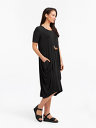 Lani short sleeve tulip dress in Black — side view
