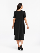 Lani short sleeve tulip dress in Black — back view