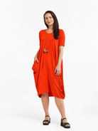 Lani short sleeve tulip dress in Orange Red — front view
