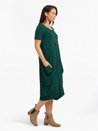 Lani short sleeve tulip dress in Pine Green — side view