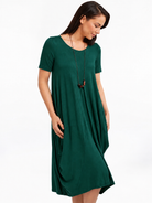 Lani short sleeve tulip dress in Pine Green — detail view