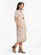 Lani short sleeve tulip dress in Sand Beige — side view