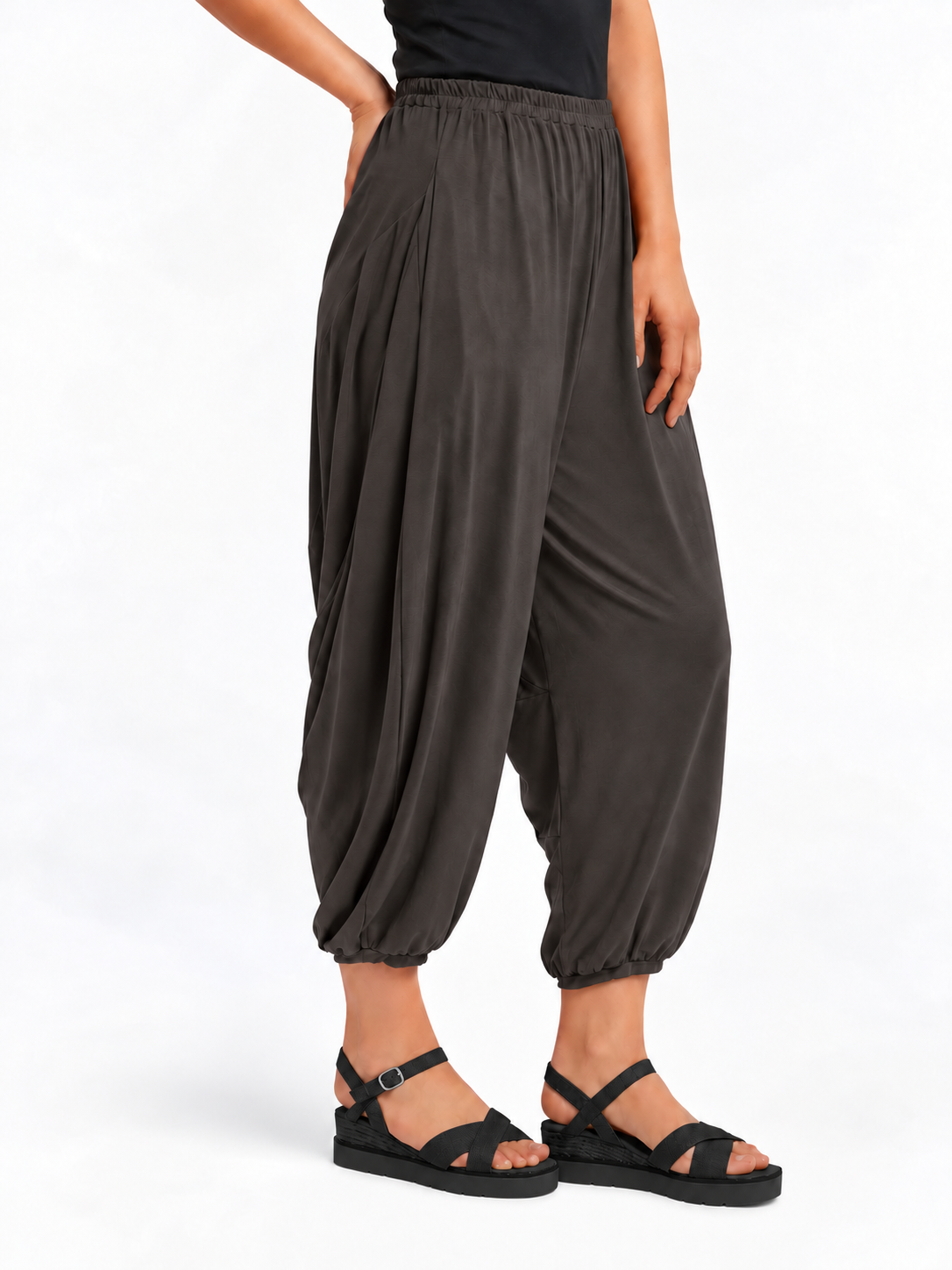 Angled side view of Graphite Grey Akira Barrel Pants, showing the side drape and barrel leg shape.
