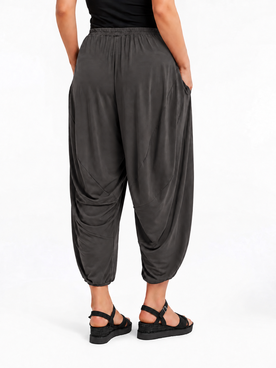 Back view of Graphite Grey Akira Barrel Pants, showing the draping back panels and cropped cuffs.