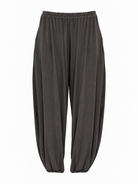 Product-only view of Graphite Grey Akira Barrel Pants, showing the elastic waistband and barrel silhouette.