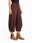angled side view of the Cocoa Marlee Wide Leg Pants, showing the side drape and leg shape