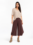 full body styled view of the Cocoa Marlee Wide Leg Pants styled with a relaxed top and ankle boots