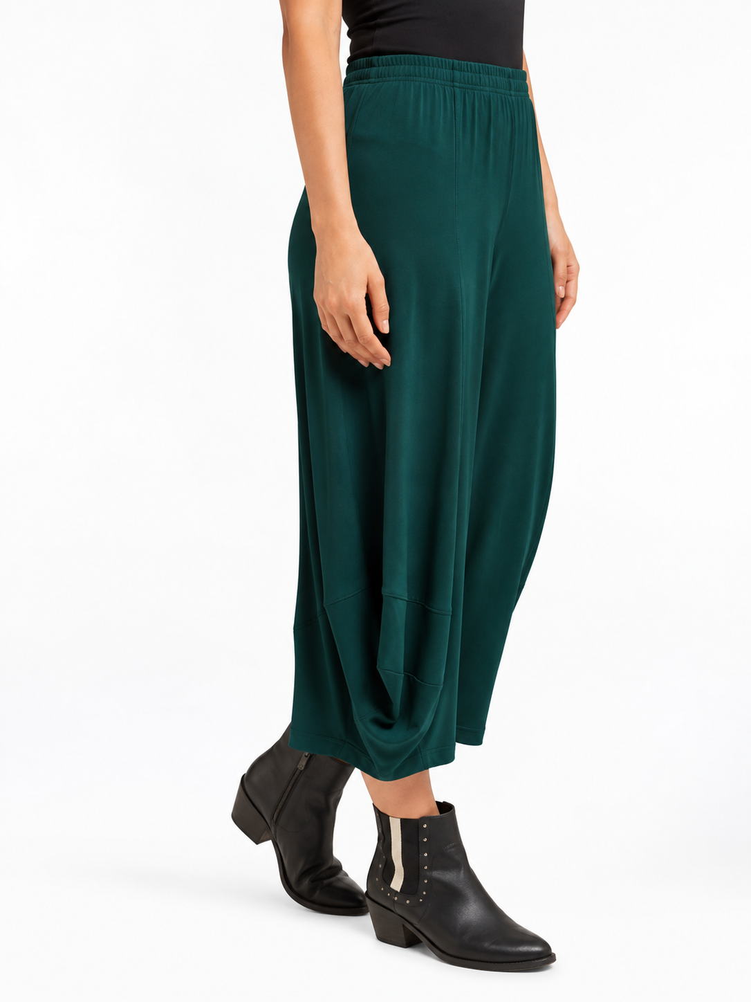angled side view of the Pine Green Marlee Wide Leg Pants, showing the side drape and leg shape
