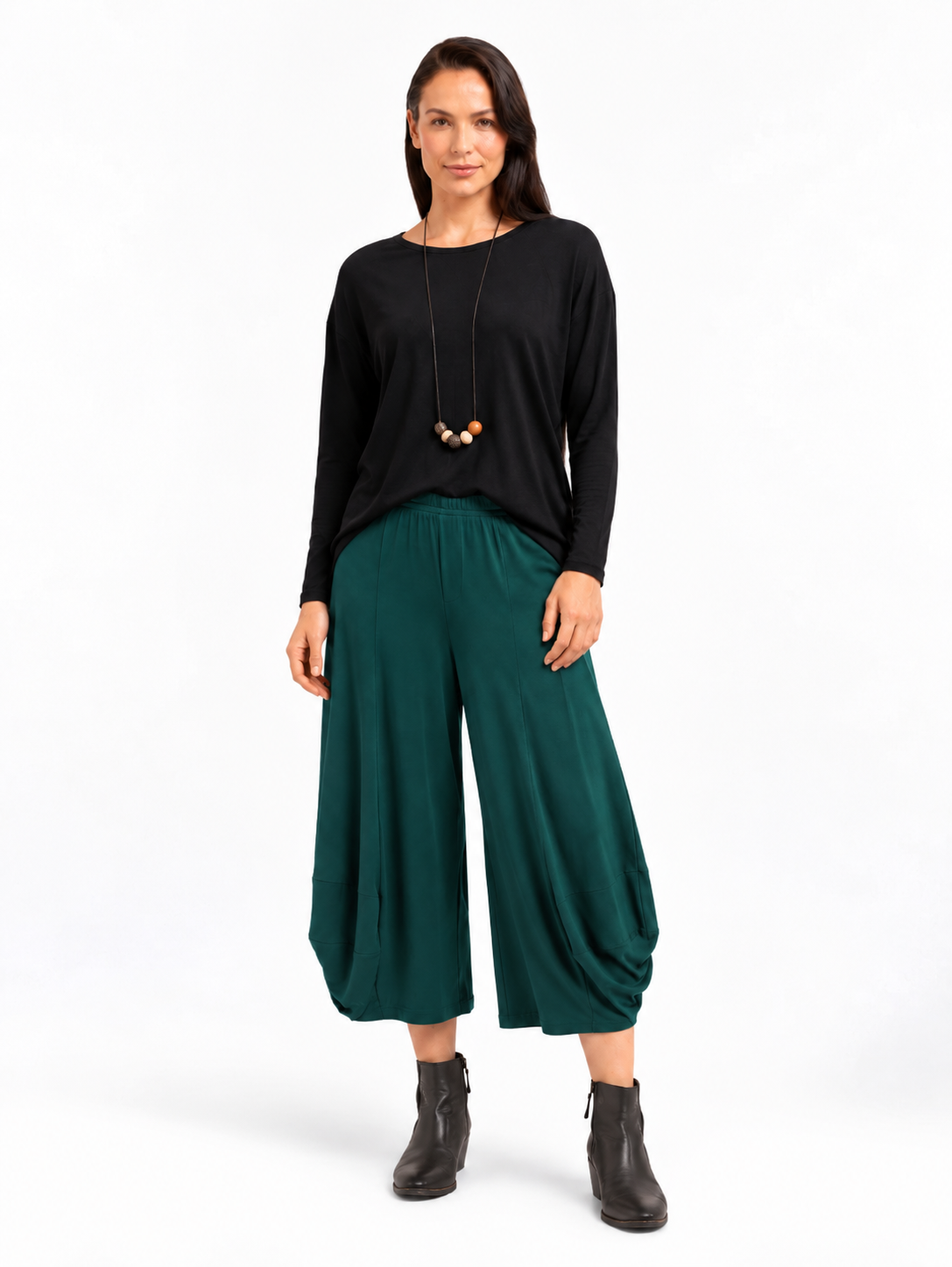 full body styled view of the Pine Green Marlee Wide Leg Pants styled with a relaxed top and ankle boots