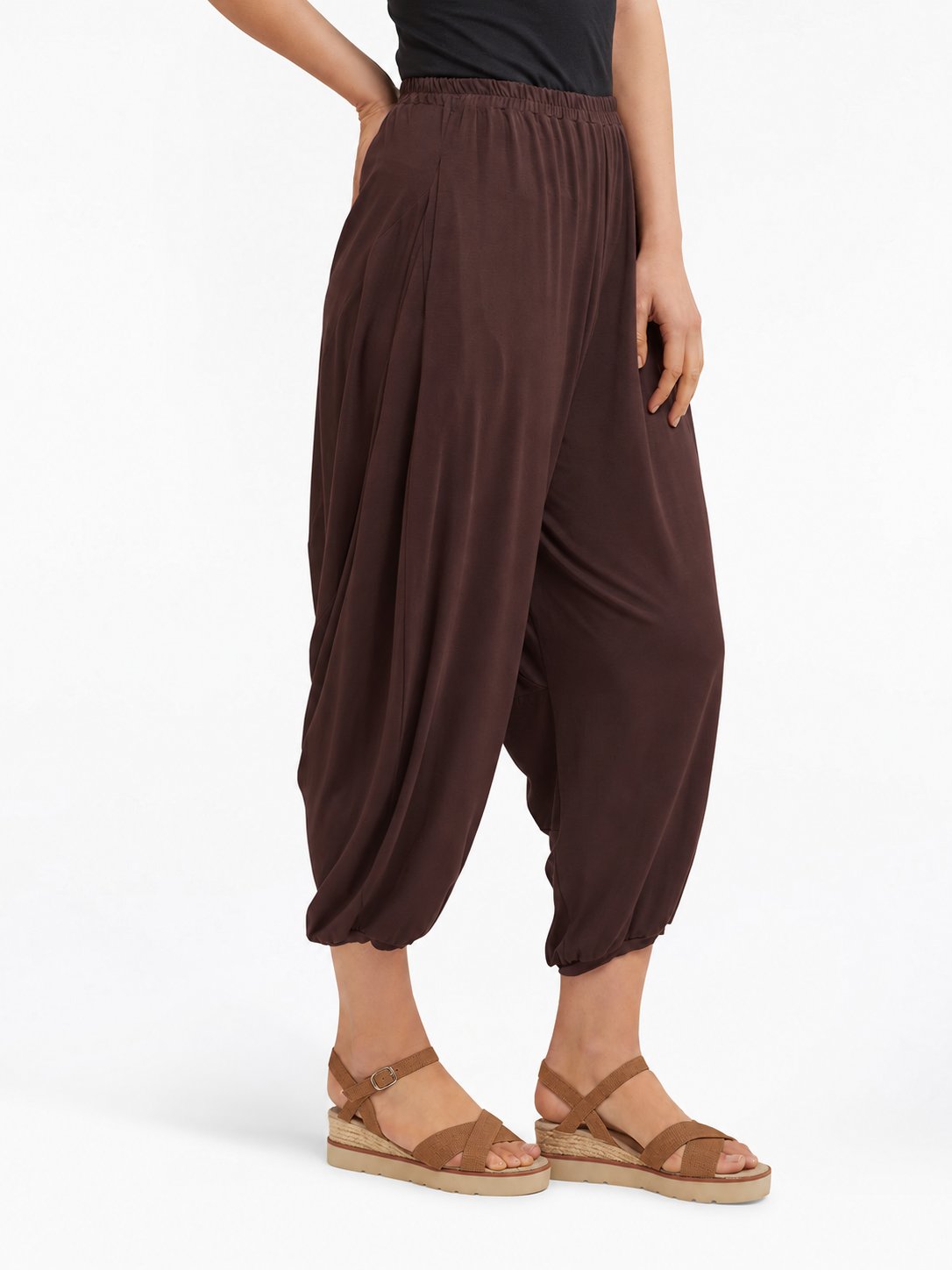 Angled side view of Cocoa Brown Akira Barrel Pants, showing the side drape and barrel leg shape.